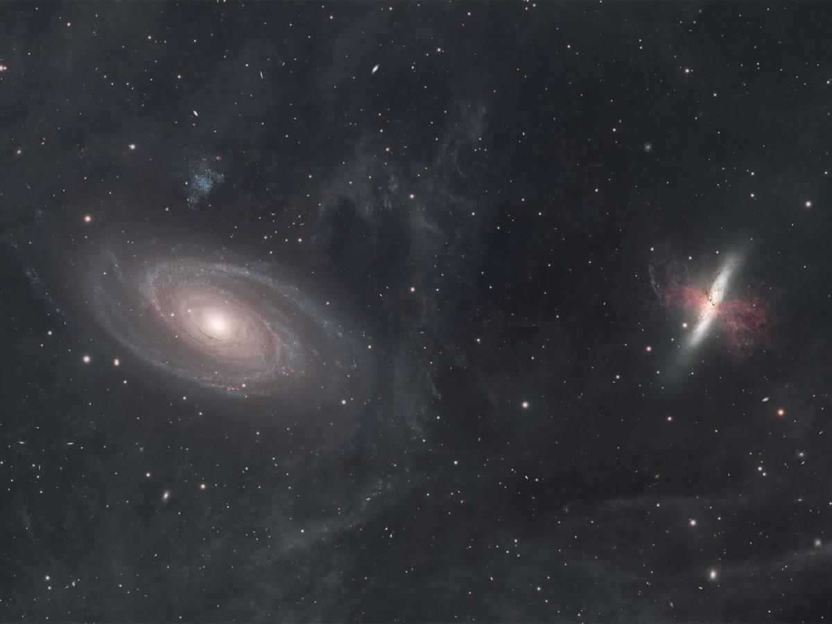 Close-up of M81 and M82 with faint integrated flux nebulosity drifting through the surrounding field